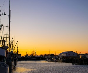View of fishing boats at sunset in Steveston, a historic fishing port near Vancouver, BC.